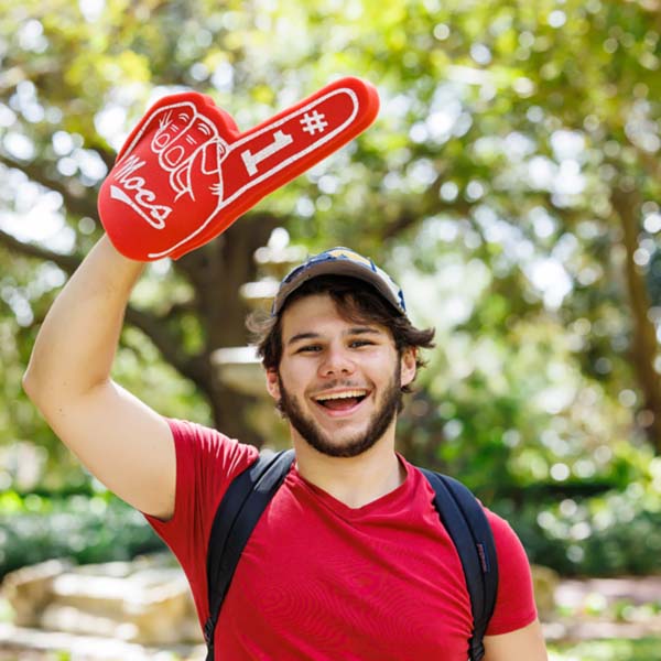 student with FSC Mocs foam finger