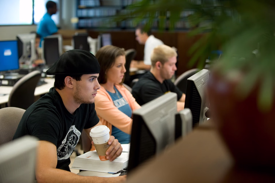 Students drinking Starbucks and working on Tutu's computers