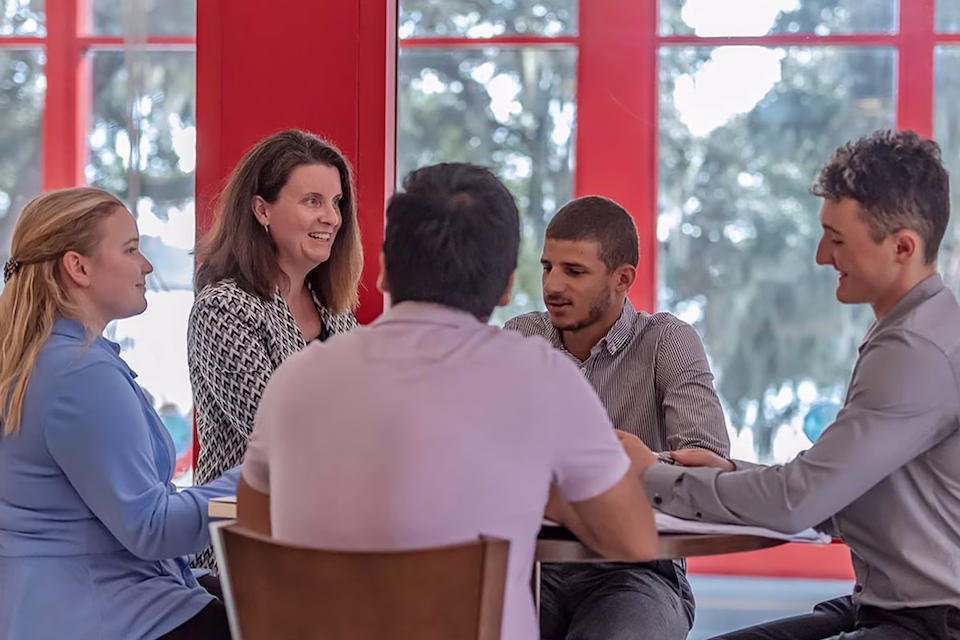 Students having discussion at round table