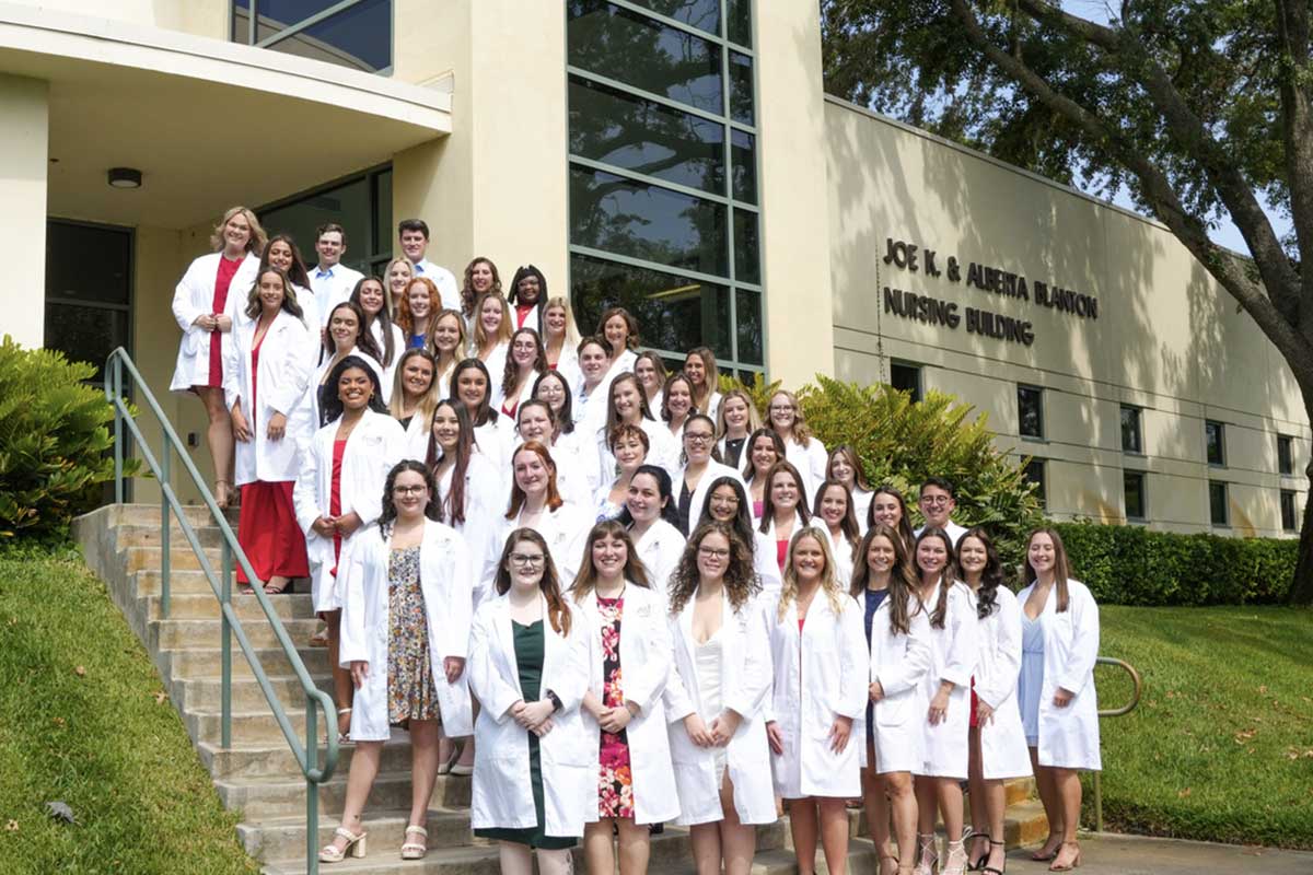 the nurses lined up on the Nursing building stairs