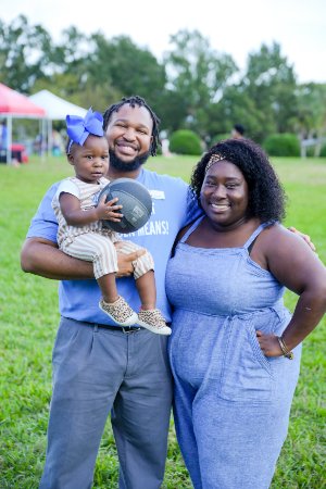 Thomas Range with his wife and daughter.